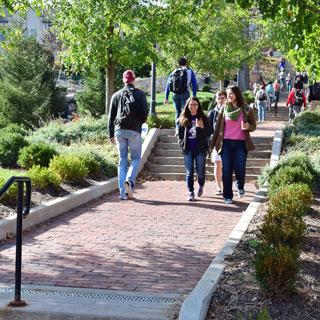 Students walking on the raven walk.